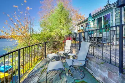 a group of chairs sitting on the balcony of a house at By Mtn Creek Resort The Point on Highland Lake in Highland Lakes