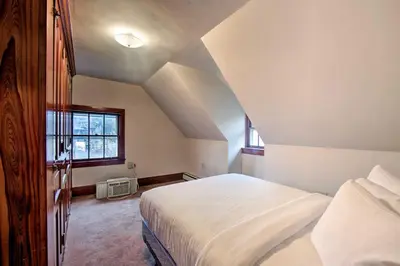 a bedroom with a white bed and a window at 2 Mi to Reading Pagoda Spacious Home with Deck! in Reading