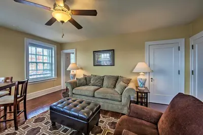 a living room with a couch and a ceiling fan at Walk to Shops, Dining and City Park Reading Apt in Reading