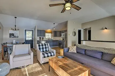 a living room with a couch and a table at Waterfront Pocono Lake Home with Private Dock! in Pocono Lake