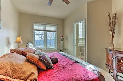 a bedroom with a pink bed with pillows and a window at Townhome with Grill Less Than 1 Mi to Big Boulder Mountain in Lake Harmony
