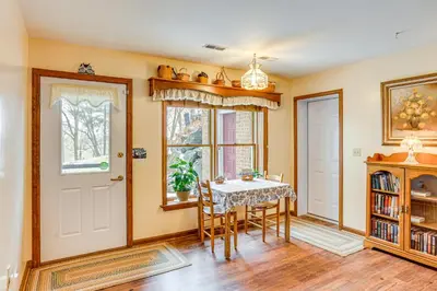 a dining room with a table and chairs at Charming Apartment with Yard and Beautiful Gardens! in Manheim
