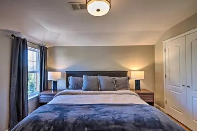 a bedroom with a large bed and two lamps at Modern Elizabeth Apt by Dining and NYC Transit! in Elizabeth