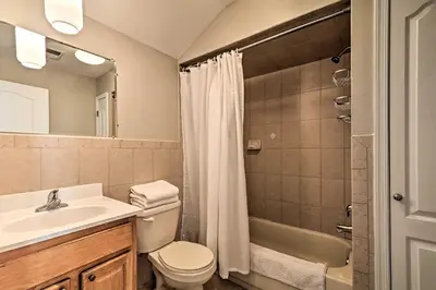a bathroom with a sink and a toilet and a shower at Modern Elizabeth Apt by Dining and NYC Transit! in Elizabeth