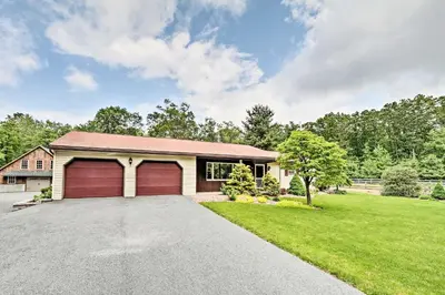 a house with a garage and a driveway at Family Home with WiFi, 14 Mi to Dutch Wonderland! in New Holland