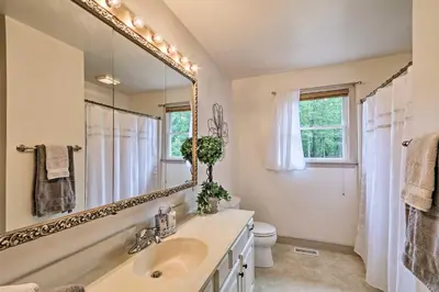 a bathroom with a sink and a mirror at Family Home with WiFi, 14 Mi to Dutch Wonderland! in New Holland