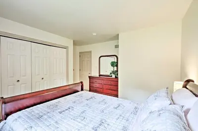 a bedroom with a bed and a dresser and a mirror at Family Home with WiFi, 14 Mi to Dutch Wonderland! in New Holland