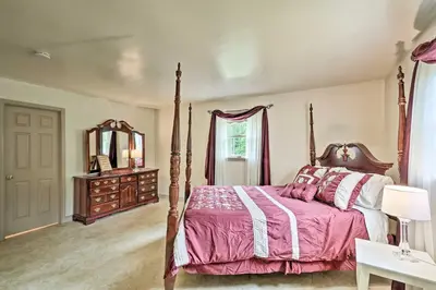 a bedroom with a canopy bed and a mirror at Family Home with WiFi, 14 Mi to Dutch Wonderland! in New Holland