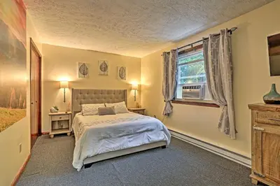 a bedroom with a bed and a window at 15 Mi to Camelback Ski Resort Home with Deck! in Tobyhanna