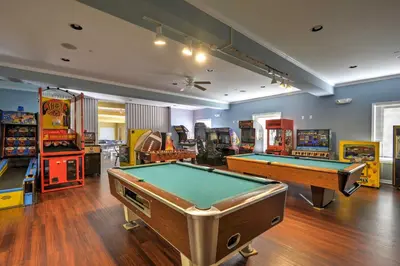 a play room with pool tables and arcade machines at half Mi to Hideout Ski Lake Ariel Resort Home! in Lake Ariel