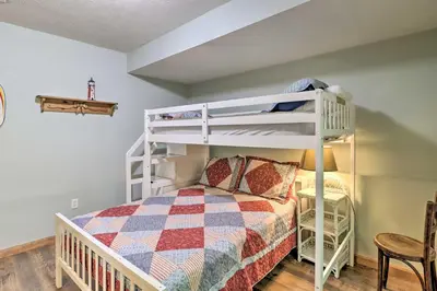 a bedroom with a bunk bed and a bunk bed at Deck, Hot Tub and Game Room Lake Harmony Home in Lake Harmony