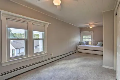 a bedroom with a bed and a window at Lake Hopatcong Family Home with Boat Slip and Dock in Hopatcong