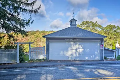 a garage with a cross on top of it at Lake Hopatcong Family Home with Boat Slip and Dock in Hopatcong