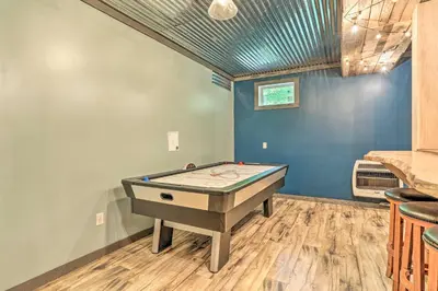 a pool table in a room with blue walls at Palmerton Cabin with Game Room about 5 Mi to Blue Mtn in Palmerton