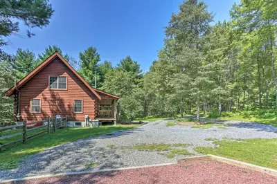 a home for sale in the woods with a barn at Palmerton Cabin with Game Room about 5 Mi to Blue Mtn in Palmerton