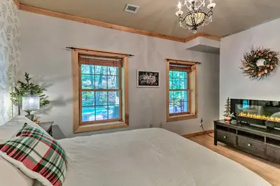 a bedroom with a bed and a fireplace at Expansive Group Getaway 11 Mi to Lancaster! in New Providence