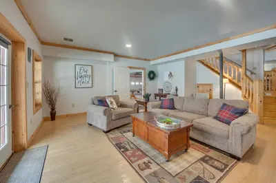 a living room with two couches and a table at Expansive Group Getaway 11 Mi to Lancaster! in New Providence