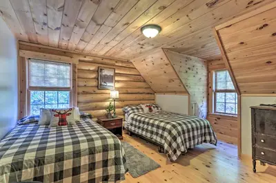 a bedroom with two beds in a log cabin at Expansive Group Getaway 11 Mi to Lancaster! in New Providence
