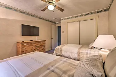 a bedroom with two beds and a flat screen tv at 1 Mi to Jack Frost Ski Resort Water-View Retreat in Lake Harmony