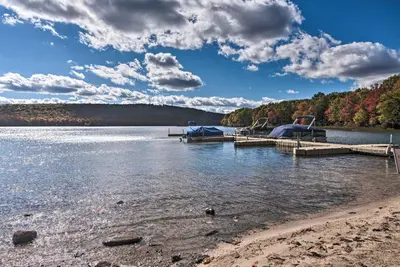 a dock on a lake with boats in the water at 1 Mi to Jack Frost Ski Resort Water-View Retreat in Lake Harmony