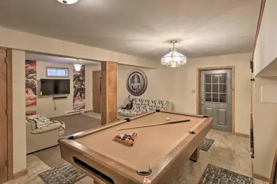 a living room with a pool table in it at 5 Mi to Camelback Henryville Home with Hot Tub! in Henryville