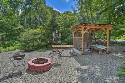 a backyard with a gazebo and a fire pit at 5 Mi to Camelback Henryville Home with Hot Tub! in Henryville