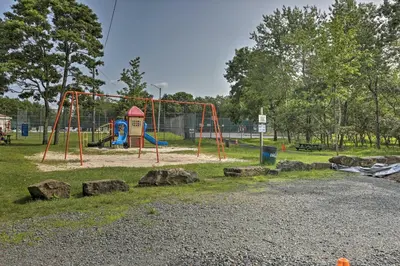 a park with a playground with a swing at Deck, Game Room and Fire Pit Poconos Retreat in Albrightsville