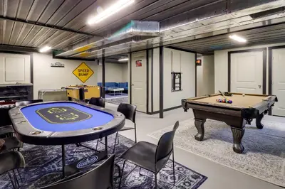a room with a pool table and chairs at Deck, Game Room and Fire Pit Poconos Retreat in Albrightsville