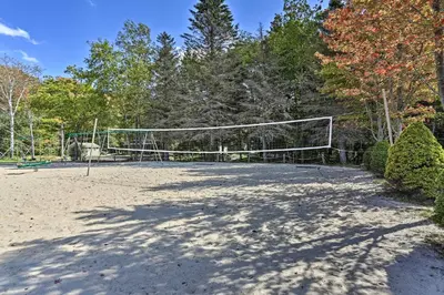 a volleyball court with a net in a park at 9 Mi to Jack Frost Slopes! Bear Den with Game Room in Pocono Lake
