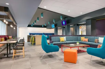 a lobby with couches and tables and chairs at Tru By Hilton Easton in Easton