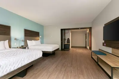 a hotel room with two beds and a flat screen tv at Tru By Hilton Easton in Easton