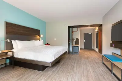 a hotel room with a bed and a flat screen tv at Tru By Hilton Easton in Easton