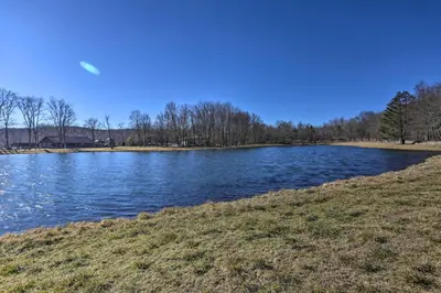 a view of a river on a sunny day at Fire Pit and Games! Secluded Chalet 30 Mi to Montage in Lake Ariel