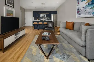 a living room with a couch and a table at StayCozy at The Frankford in Philadelphia