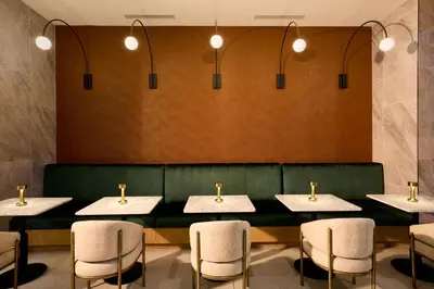 a row of tables and chairs in a restaurant at Delta Hotels by Marriott New York Times Square in New York