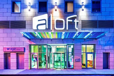 a building with an alot sign on the side of it at Aloft Manhattan Downtown - Financial District in New York