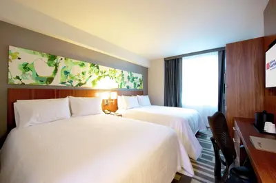 a hotel room with two beds and a window at Hilton Garden Inn New York Central Park South-Midtown West in New York