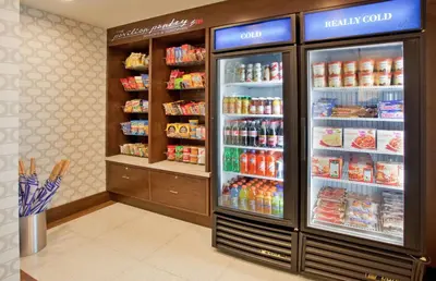 a store with a refrigerator filled with lots of food at Hilton Garden Inn New York Central Park South-Midtown West in New York