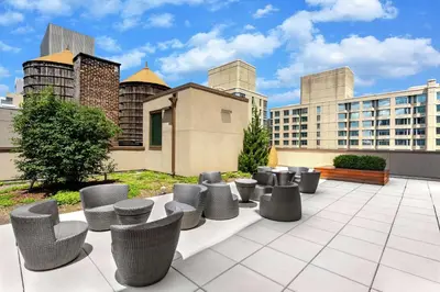 a group of chairs sitting on top of a building at Homewood Suites Midtown Manhattan Times Square South in New York