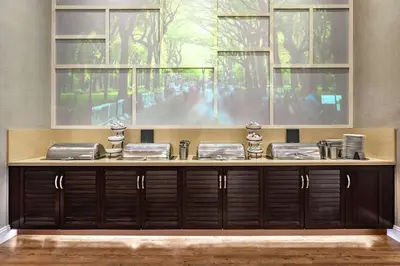 a counter with four dishes on top of it at Homewood Suites Midtown Manhattan Times Square South in New York