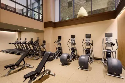 a gym with a bunch of exercise bikes in a room at Homewood Suites Midtown Manhattan Times Square South in New York