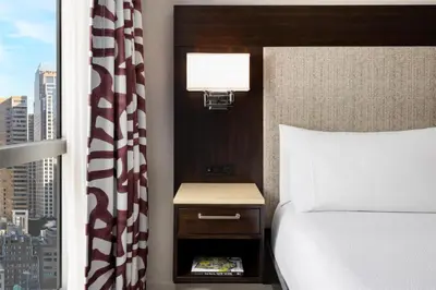 a hotel room with a bed and a window at Hilton Garden Inn New York - Times Square Central in New York