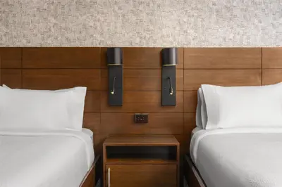 two beds in a hotel room with two bedsskirts at Hilton Garden Inn New York/Midtown Park Avenue in New York