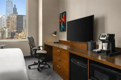 a hotel room with a flat screen tv on a desk at Hilton Garden Inn New York/Midtown Park Avenue in New York