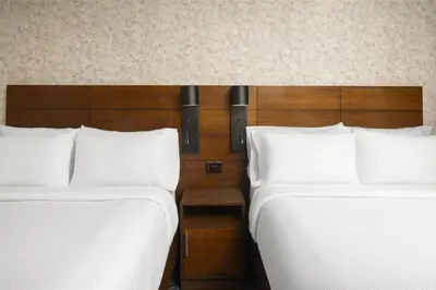 two beds sitting next to each other in a room at Hilton Garden Inn New York/Midtown Park Avenue in New York