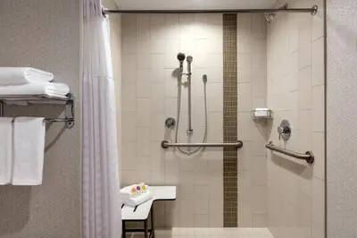 a bathroom with a shower with a glass door at Hyatt Place Fort Lee/George Washington Bridge in Fort Lee