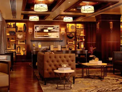 a lobby with a couch and tables in a room at WestHouse Hotel New York in New York