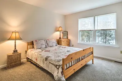 a bedroom with a bed and a window at Blue Mtn Lake Family House, Steps to Beach! in East Stroudsburg