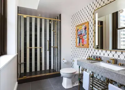 a bathroom with a shower and a toilet and a sink at Canopy By Hilton Philadelphia Center City in Philadelphia