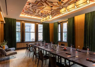 a conference room with a long table and chairs at Canopy By Hilton Philadelphia Center City in Philadelphia